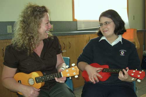 music therapy session with client - playing ukeleles